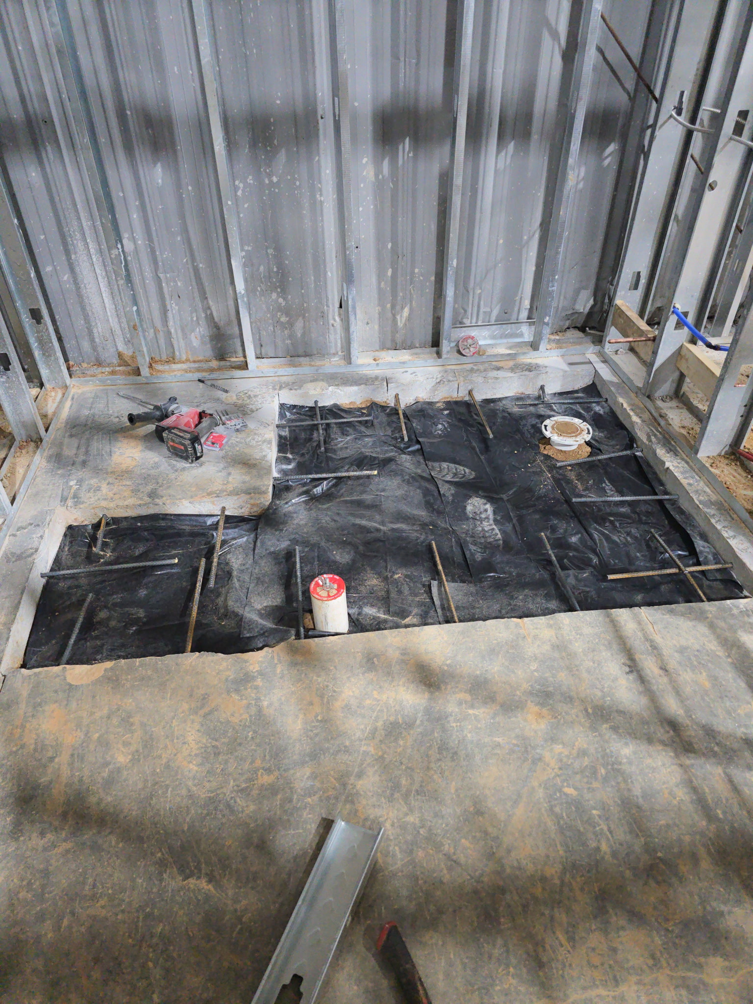 Commercial floor rough-in with toilet flange prepared for pour